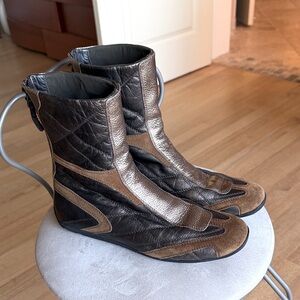 Prada quilted mixed media boots.